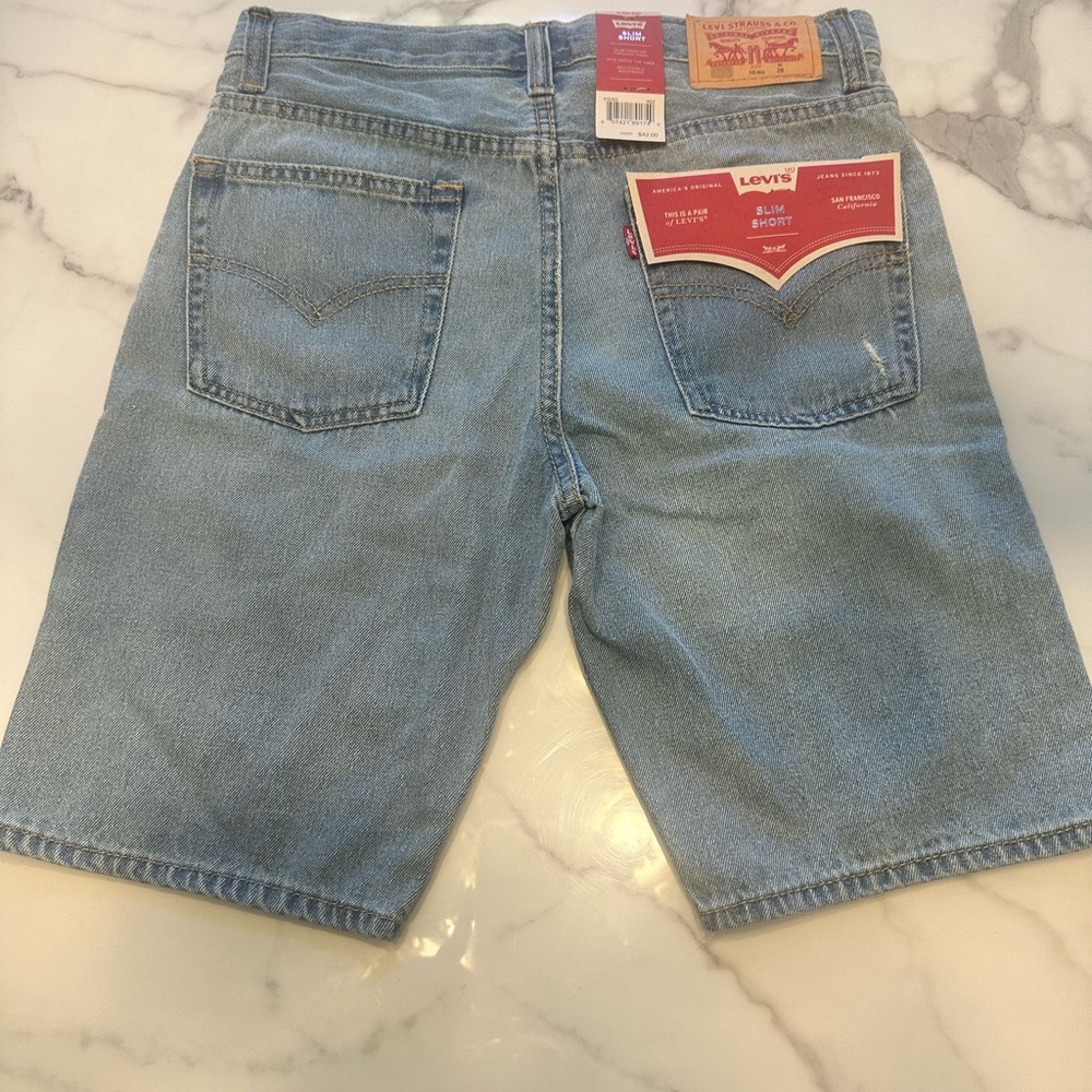 Levi's Blue Distressed Jean Shorts with Vintage-Inspired Patches - Picture 2 of 3